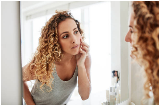 Women analyzing her skin